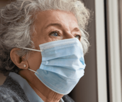 Elderly woman wearing a mask depression in seniors