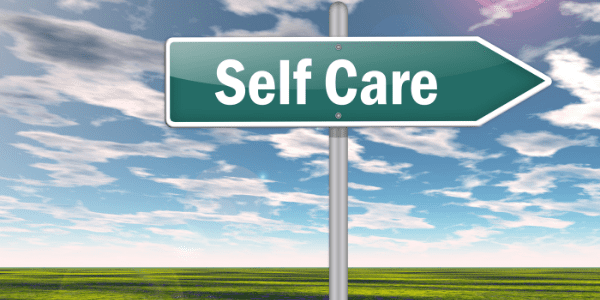 caregiver guilt Road sign saying "self-care"