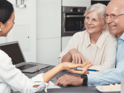 Senior Care Planning by an elderly couple sitting at a desk